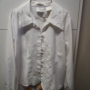 Fancy embroidered white blouse.